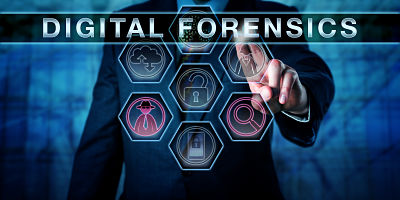 Male cyber crime investigator pressing DIGITAL FORENSICS on an interactive touch screen monitor. Investigative concept for computer forensics, network forensics and the electronic discovery process.